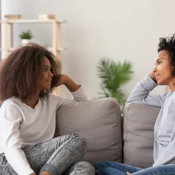 Woman And Girl Talking Gettyimages 1133045042